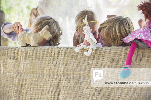 Children playing with toys in tree house