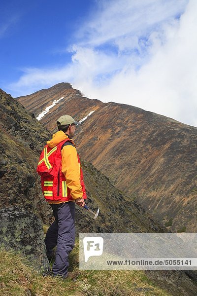 Geologist exploring for minerals in alpine area  Hudson Bay Mountain  Smithers  British Columbia  Canada