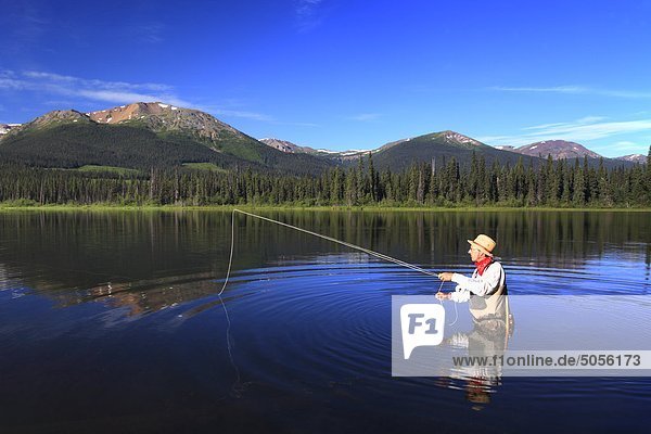 Flyfisherman fishing for trout  Dennis Lake  British Columbia