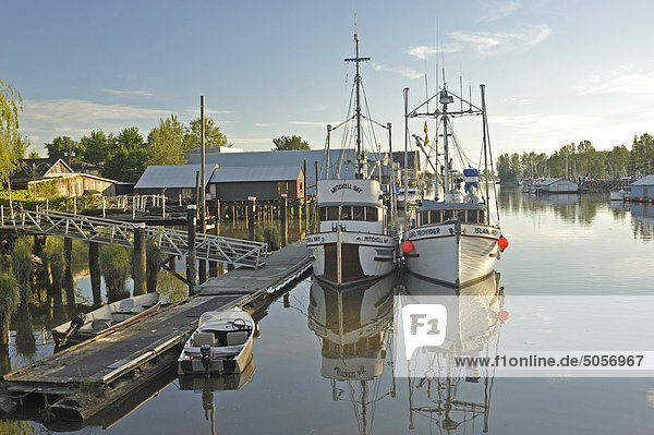 fishing boats moored in Fraser river at Ladner  South Delta  British Columbia  Canada