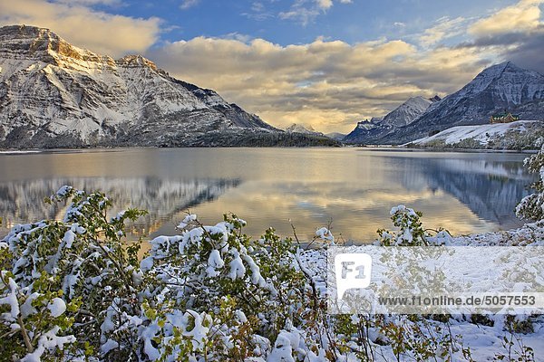 Prince of Wales Hotel opposite Mt Vimy and overlooking Middle Waterton Lake after the first snowfall of winter  Waterton Lakes National Park  Alberta  Canada.