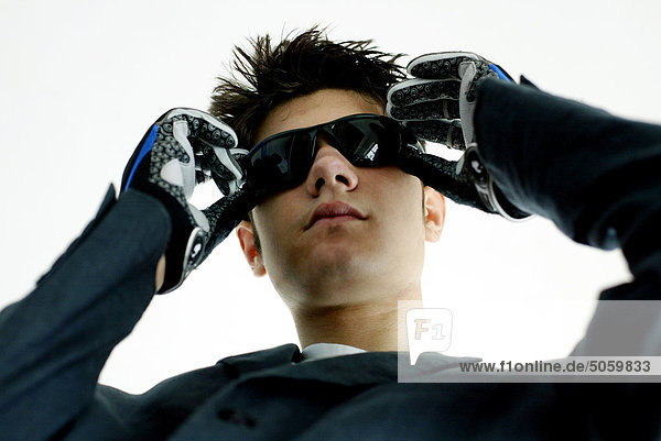 Teenage boy with sunglasses and gloves