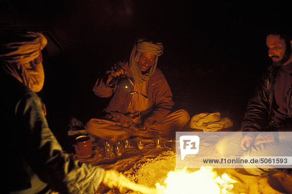 Algeria - Sahara  Erg Chech Desert  men near the fire