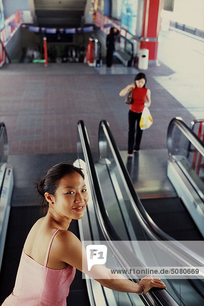 Girl in a skytrain station  Bangkok  Thailand