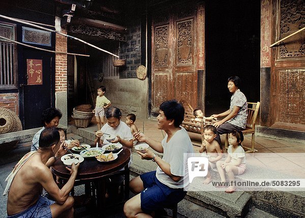 Family having meal  China