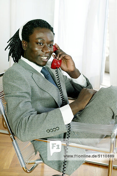 Afro - american businessman talking at the telephone