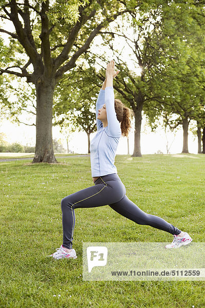 Woman stretching in park