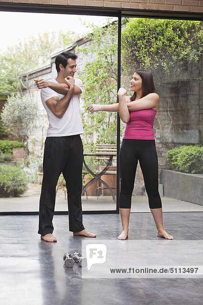 Couple stretching before exercise