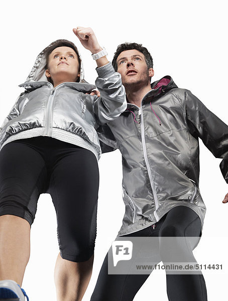 Low angle view of couple jogging