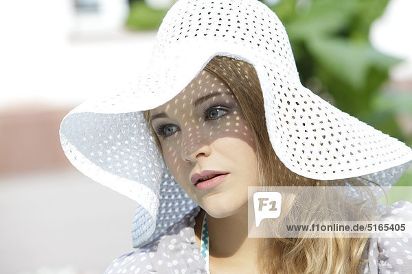 Young woman with white hat