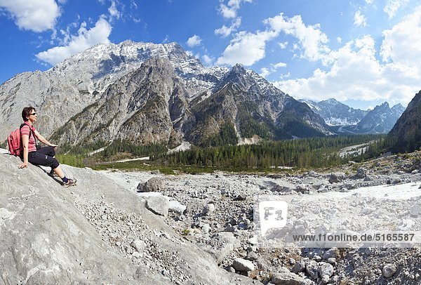 Woman resting in the Wimbach Valley Berchtesgadener Alps Germany