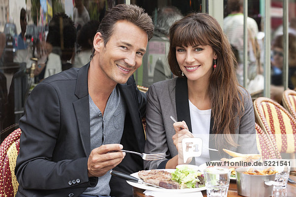Couple enjoying lunch at a restaurant  Paris  Ile-de-France  France