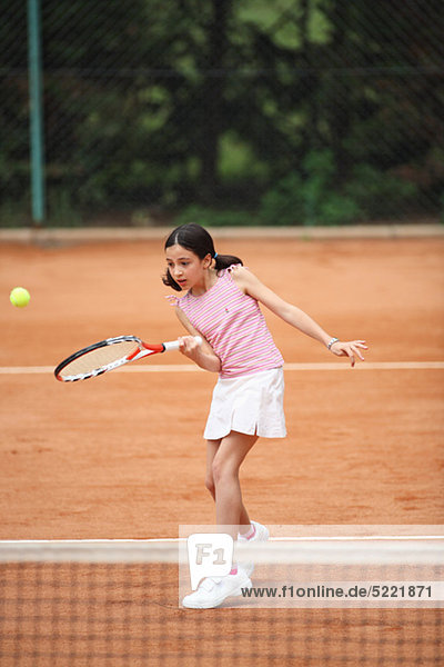Caucasian Girl Playing Tennis