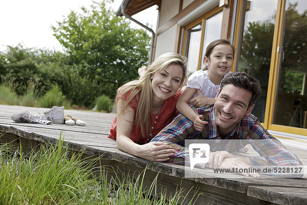 Family in front of Lehner energy house  Poing  Bavaria  Germany  Europe
