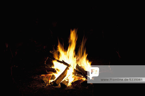 A campfire burning at night