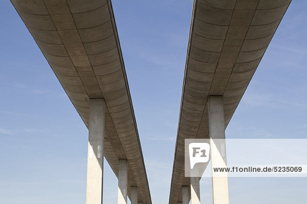 Low angle view of concrete overpasses