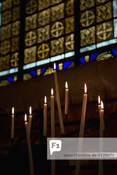 Lit candles in a church