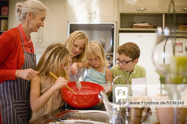 Family cooking together in kitchen