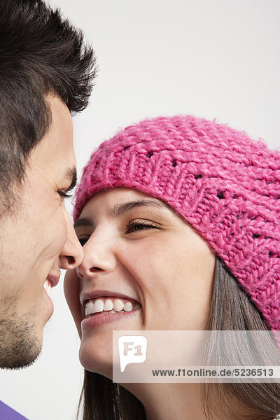 Smiling couple touching noses