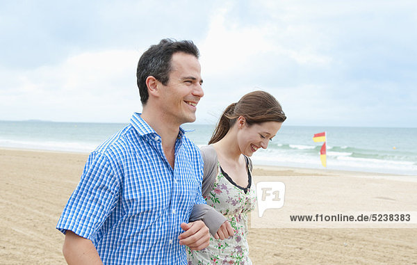 Couple walking on beach