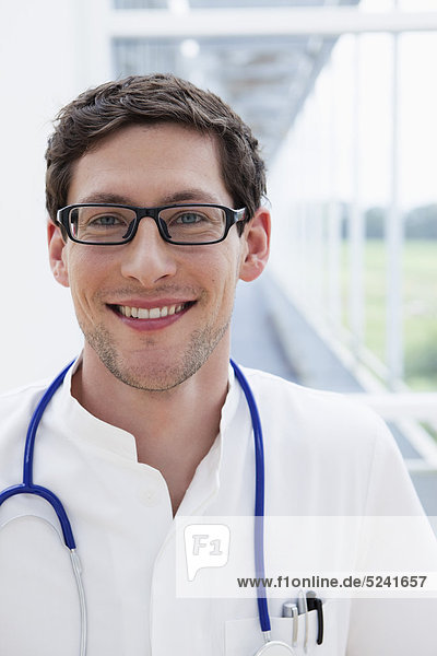 Germany  Bavaria  Diessen am Ammersee  Close up of young doctor with stethoscope  smiling  portrait