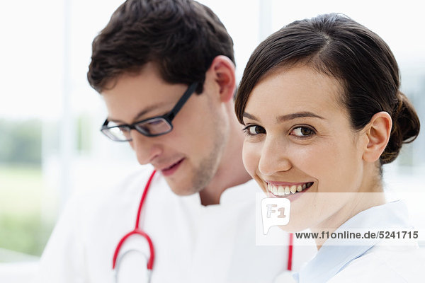 Germany  Bavaria  Diessen am Ammersee  Close up of two young doctors  smiling