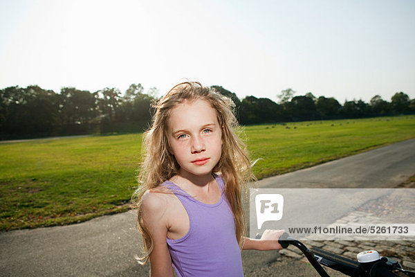Young girl on bicycle  portrait