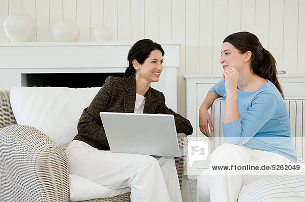 Young woman meeting financial advisor at home