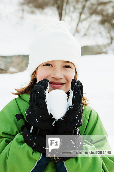Young Girl Holding snowball