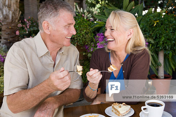 Mature couple having cake