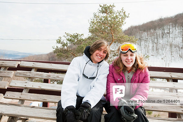 Young couple wearing winter sports clothing  portrait