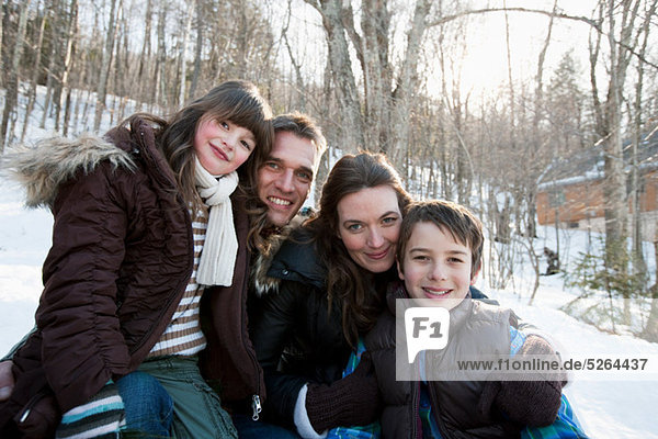 Family in snow  portrait