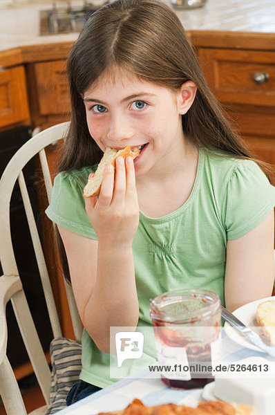 Girl eating croissant