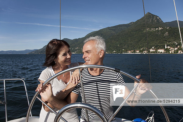Older couple sailing together