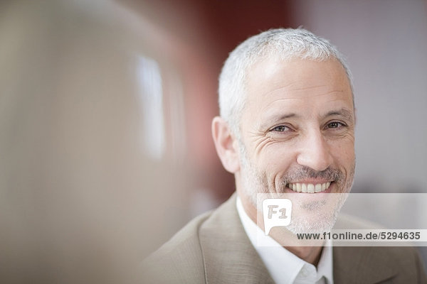 Close up of businessman’s smiling face