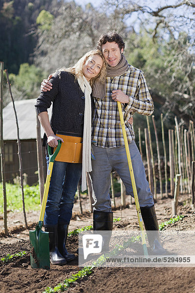 Couple gardening together