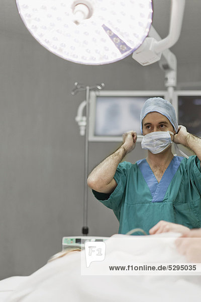 Surgeon preparing in operating room