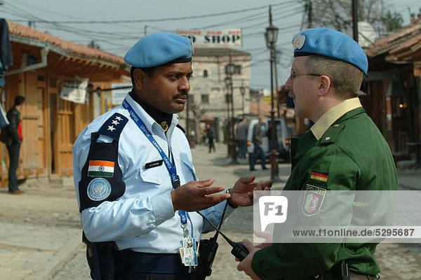 Indian  Kosovan and German police officers  international police patrol in the old town of Gjakova  the police operations are part of the United Nations Mission in Kosovo  UNMIK  in Gjakova  Kosovo  Europe
