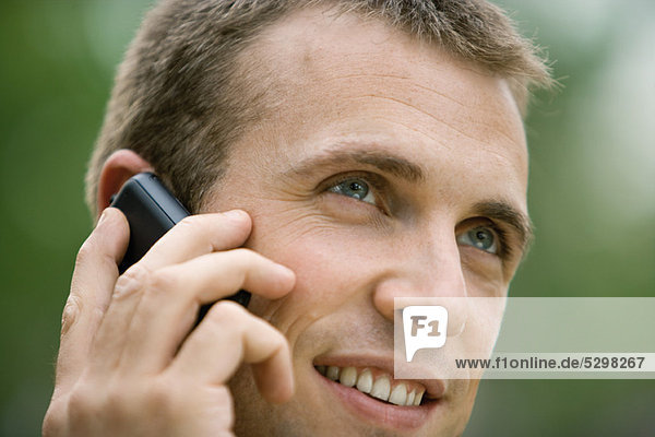 Man using cell phone outdoors