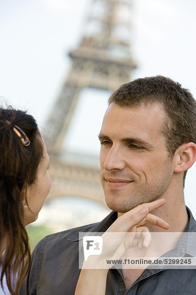 Woman caressing man's face