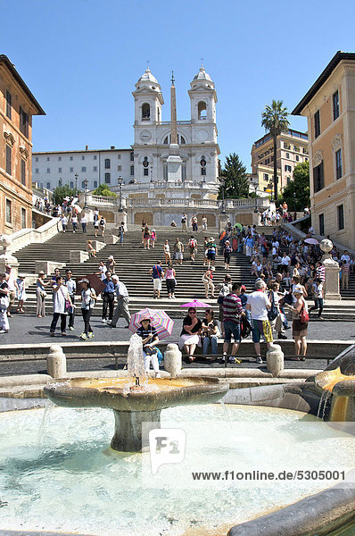 Fontana della Barcaccia fountain and tourists on the Spanish Steps  Piazza di Spagna  Rome  Italy  Europe