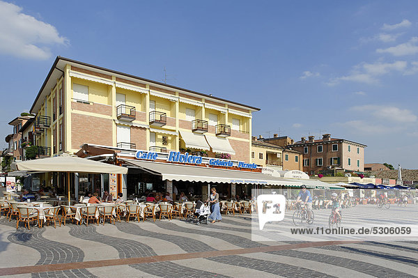 Bars and ice cream shops along the lakeside promenade in Lazise on Lake Garda  Lago di Garda  Veneto region  Italy  Europe