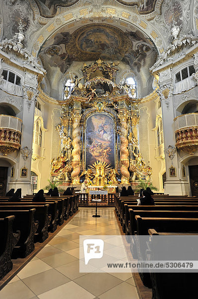 Morning prayer  interior view of Ursulinenkirche church  built in 1741  last joint project of the Asam brothers  Straubing  Bavaria  Germany  Europe