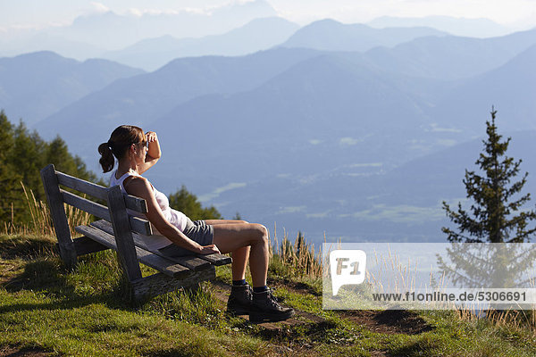 Female hiker having a rest  Nockberge  Nock Mountains  Carinthia  Austria  Europe