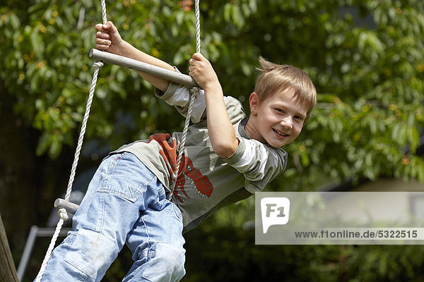 Boy on a swing  Carinthia  Austria  Europe