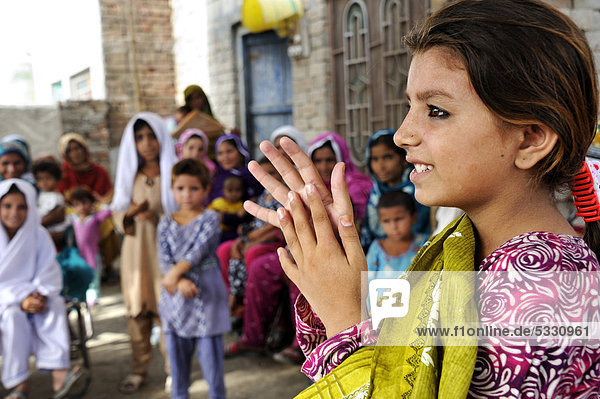 Girl participating in a hygiene campaign  instructions for handwashing  Lashari Wala village  Punjab  Pakistan  Asia
