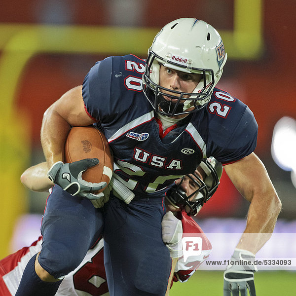 Taylor Malm  #20 USA  is tackled at the Football World Championship on July 16  2011  USA wins 50:7 against Canada and wins the tournament  Vienna  Austria  Europe