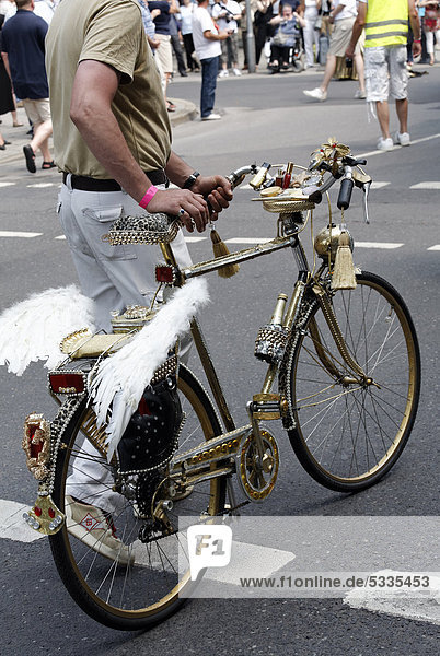 Golden bicycle decorated with Pegasus wings  Christopher Street Day in Duesseldorf  North Rhine-Westphalia  Germany  Europe
