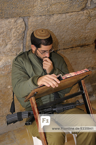 Praying Jewish soldier in the underground part of the Western Wall  Wailing Wall  Old City  Arab Quarter  Jerusalem  Israel  Western Asia