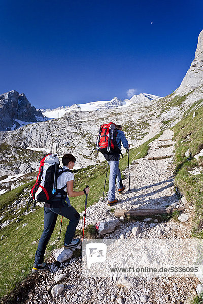 Climbers ascending the Marmolada  via ferrata  west ridge  Marmolada at back  Dolomites  Trentino  Italy  Europe